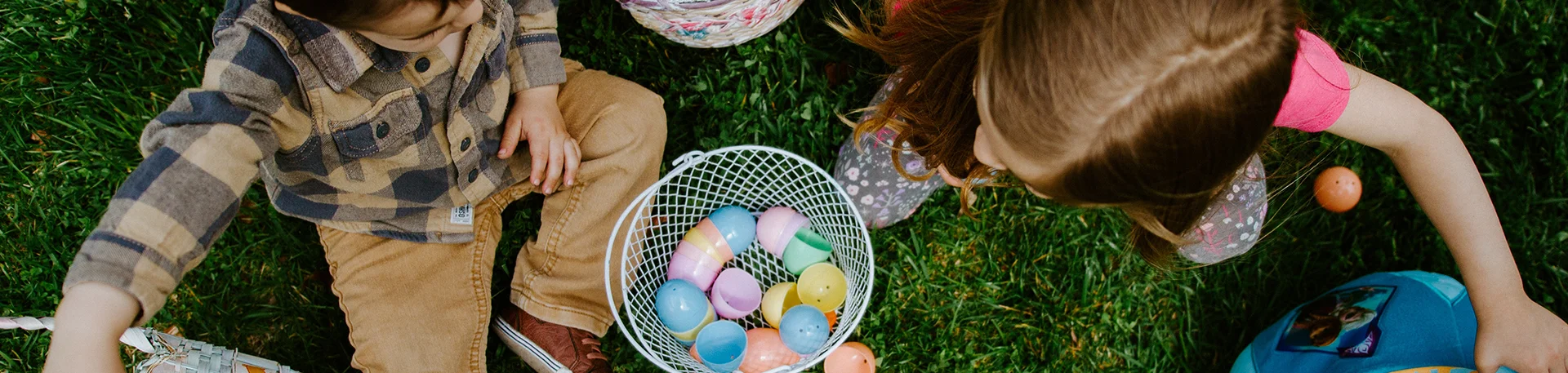 little girl and boy going on a treasure hunt to find easter eggs