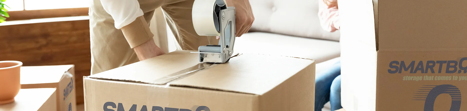 man packing carton box for storage