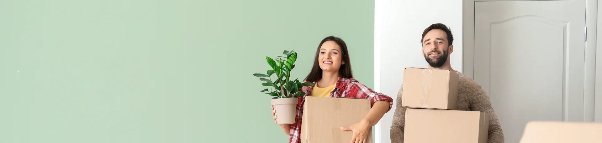 happy young couple moving house