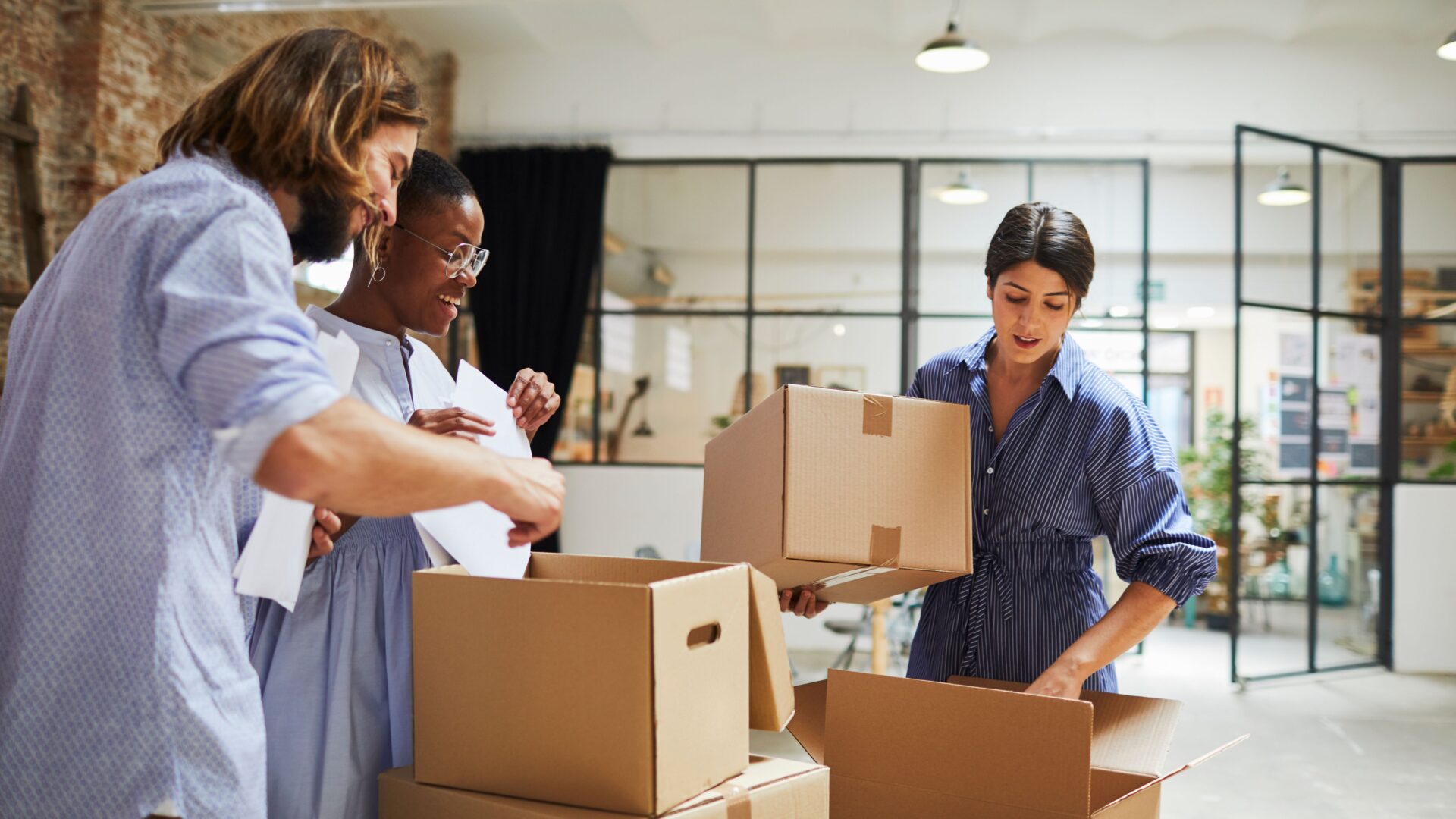 People packing moving boxes